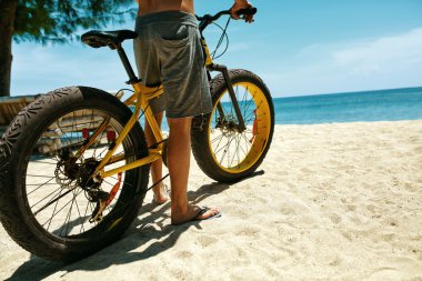 Close Up Man Riding Sand Bicycle On Beach. Summer Sport