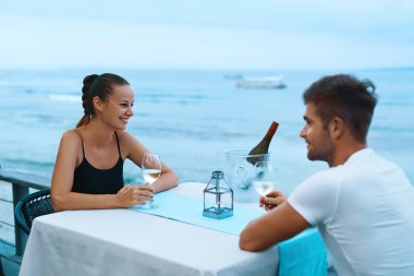 Romantic Couple In Love Having Dinner At Sea Beach Restaurant