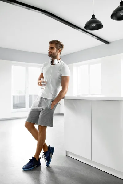 Healthy Nutrition. Man Drinking Glass Of Fresh Water In Morning — Stock Photo, Image