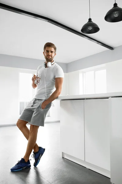 Healthy Nutrition. Man Drinking Glass Of Fresh Water In Morning — Stock Photo, Image