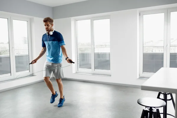 Sport Fitness Workout. Healthy Man Skipping Jump Rope Indoors. — Stock Photo, Image