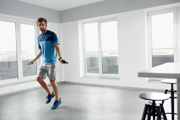 Sport Fitness Workout. Healthy Man Skipping Jump Rope Indoors. — Stock Photo, Image