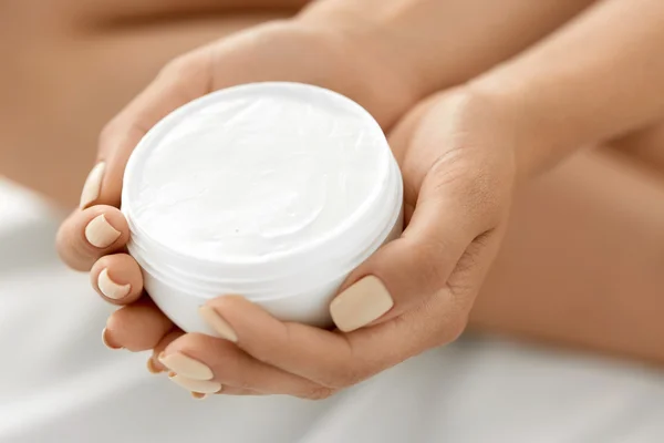 Skin Care Product. Woman's Hands Holding Beauty Cream, Lotion.