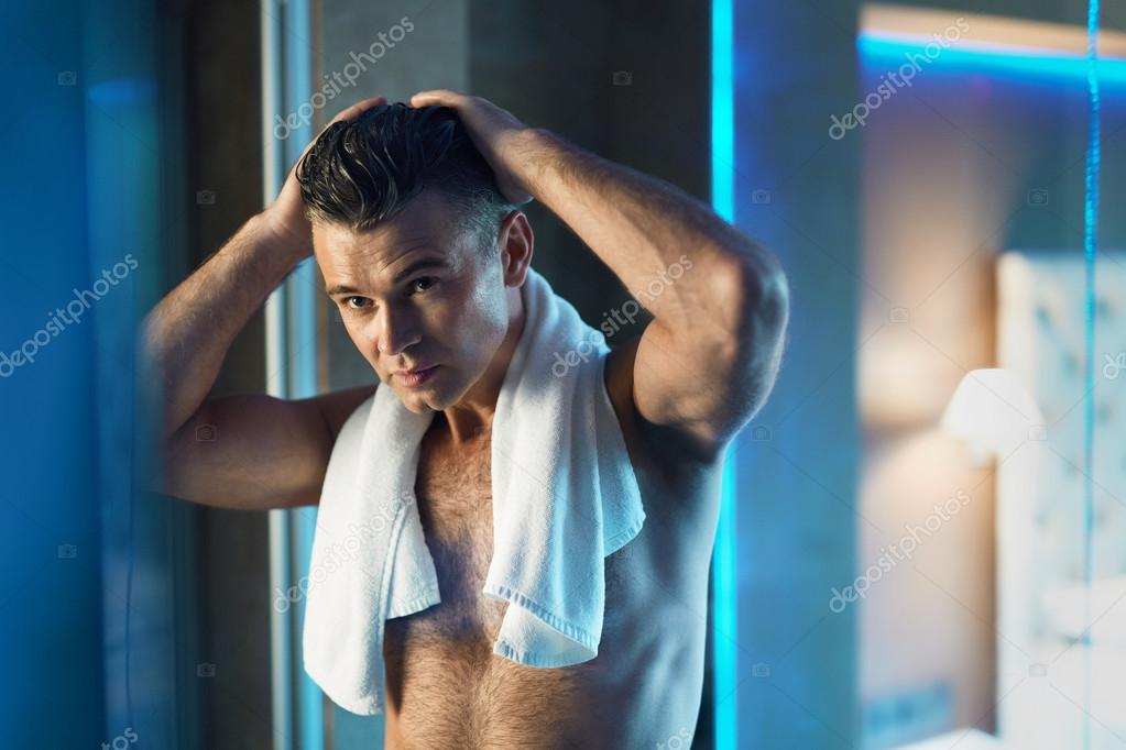 Men Hair Care. Man Touching His Hair In Bathroom. Men Grooming Stock Photo by ©puhhha 117953518 Men Hair Care. Man Touching His Hair In Bathroom. Men Grooming Stock Photo by ©puhhha 117953518