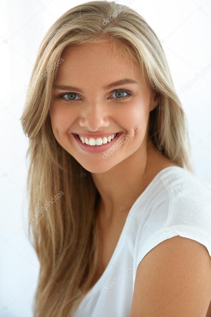 Beauty Woman Portrait. Girl With Beautiful Face Smiling Stock Photo by  ©puhhha 120485602