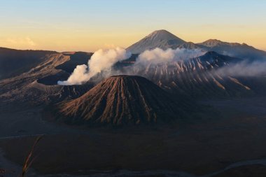 Clouds of smoke on Mount Bromo volcano, Indonesia clipart
