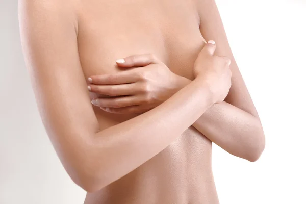 Woman checking breast for signs of cancer — Stock Photo, Image