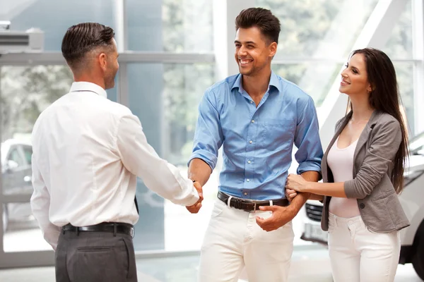 Couple is Meeting with Seller in Auto Salon — Stock Photo, Image