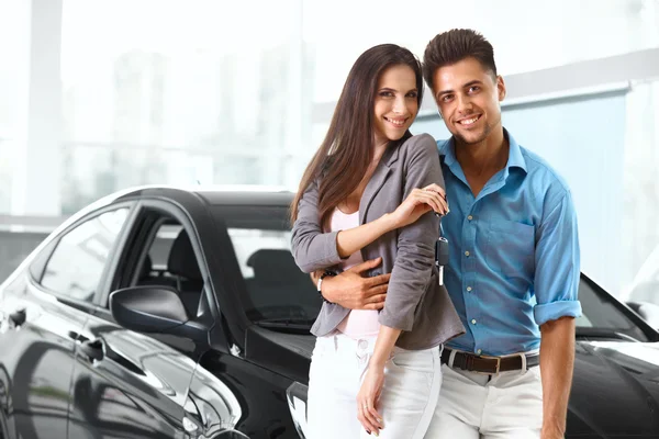 Couple Celebrating Purchase of a car — Stock Photo, Image