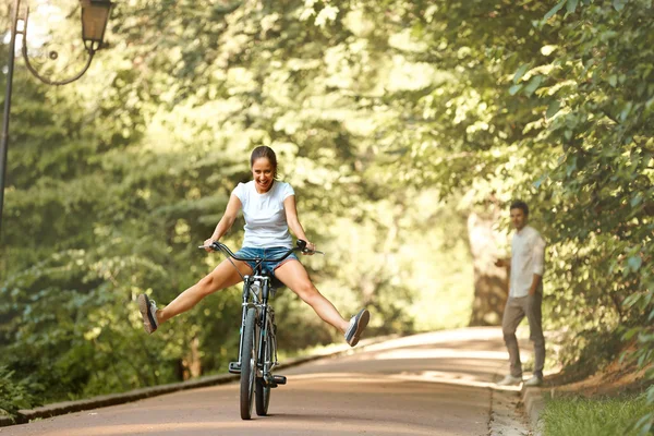 Woman is Cycling in Summer Park — Stock Photo, Image