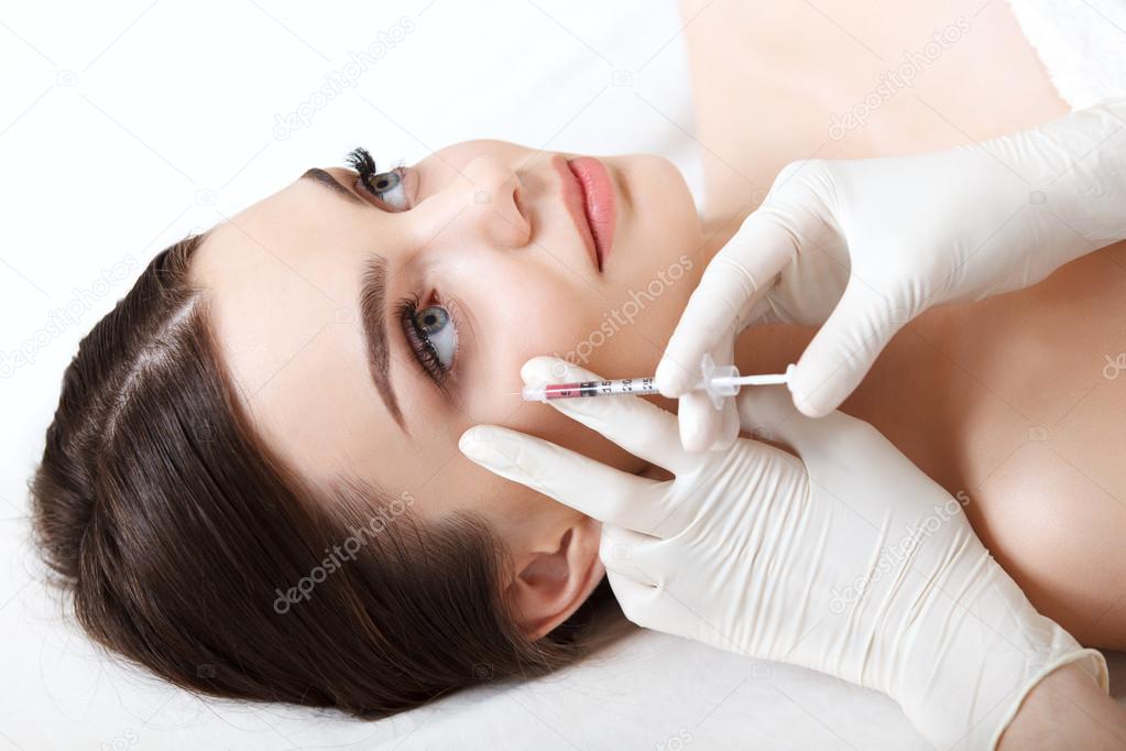 Beautiful woman gets injections.
