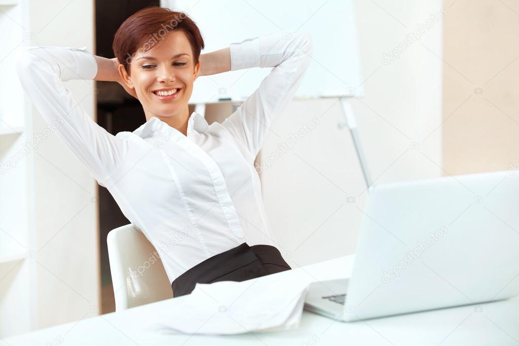 Businesswoman sitting in a bright office