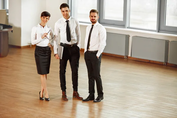 Business partners comunicating in hall — Stock Photo, Image