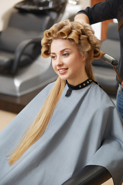 Blonde hair woman in hair salon