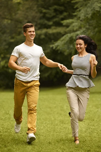 Couple in Love. Happy Couple Running in the park — Stock Photo, Image