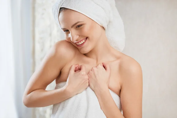 Spa Woman. Portrait of smiling young woman in towel in bathroom. — Stock Photo, Image