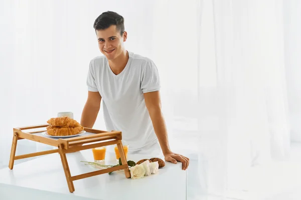 Loving man with romantic breakfast — Stock Photo, Image