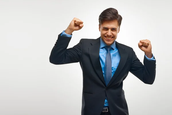 Homem de negócios comemorando o sucesso contra fundo branco — Fotografia de Stock