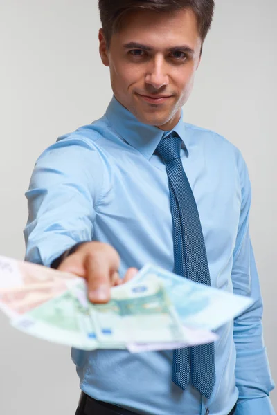 Businessman holding money Stock Image