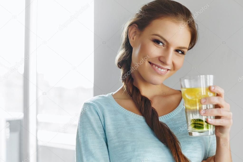 Healthy Lifestyle And Food. Woman Drinking Fruit Water. Detox. H