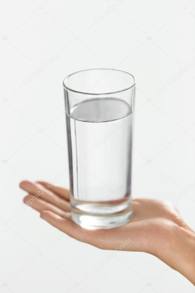 Water. Health And Diet Concept. Drinks. Woman's Hand Holding Gla