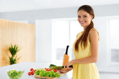 Diet. Healthy Eating Woman Cooking Organic Food. Lifestyle. Preparation. Nutrition.