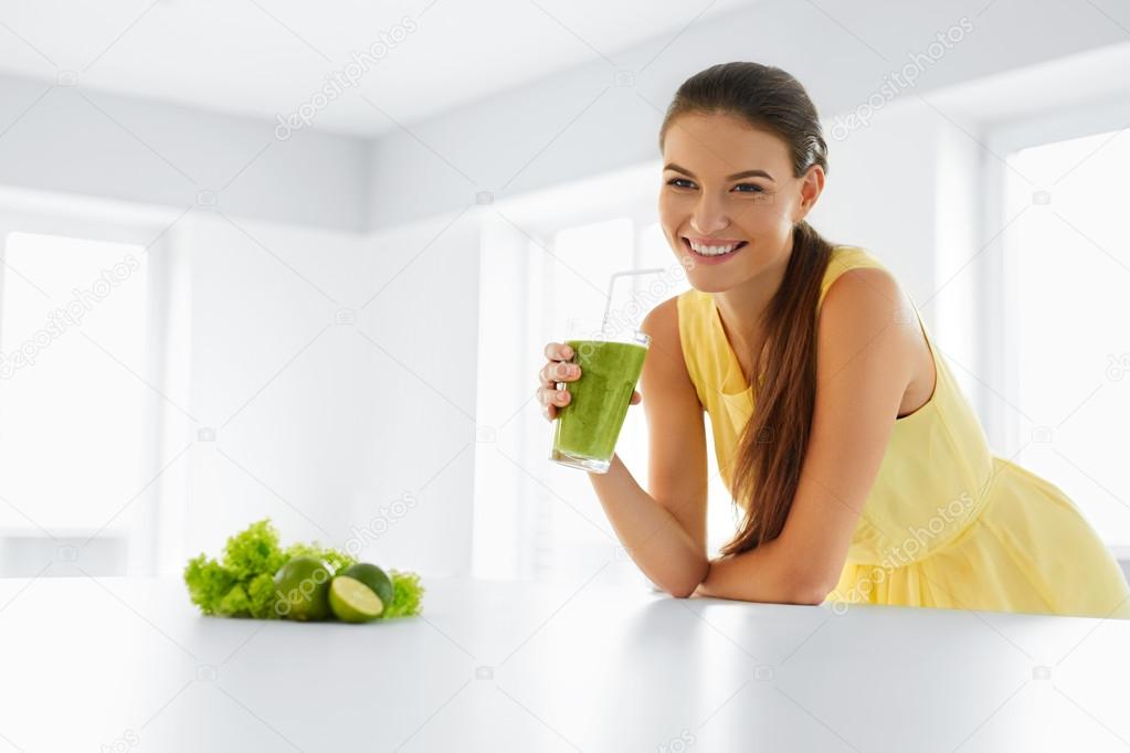 Healthy Woman  Drinking Green Detox Juice. Lifestyle, Food, Drinks, Diet