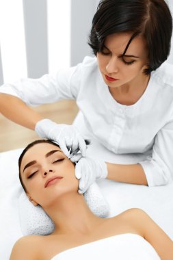 Plastic Surgery. Woman Gets Cosmetic Injection. Cosmetology. Bea