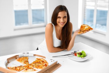 Eating Italian Food. Woman Eating Pizza. Fast Food Nutrition. Li