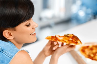 Eating Pizza. Woman Eating Italian Food. Fast Food Nutrition. Li