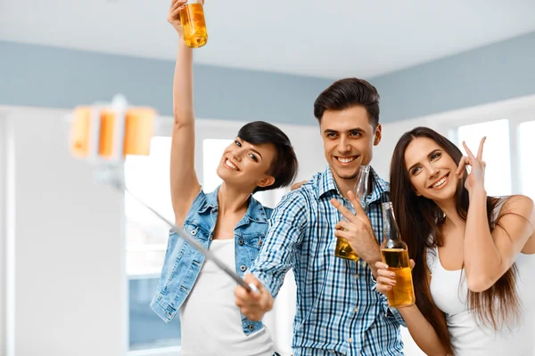 Party People. Friends Making Photo With Smartphone Selfie-stick. — Stock Photo, Image