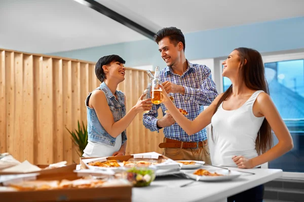 Cheers. Happy Friends Cheering Beer Bottles Indoors. Party. Cele — Stock Photo, Image