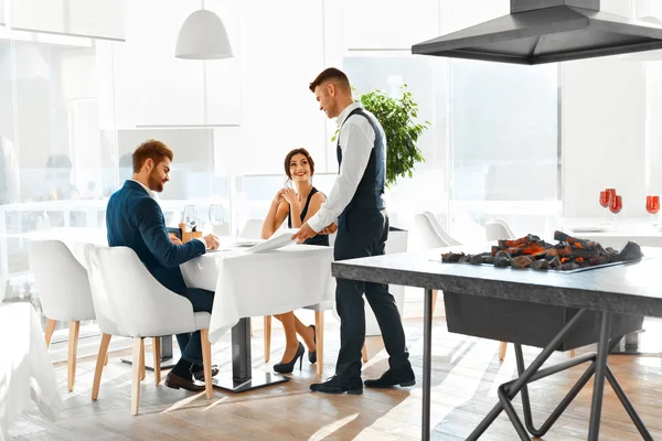 Romantic Dinner. Happy Couple In Love Ordering Food In Restauran