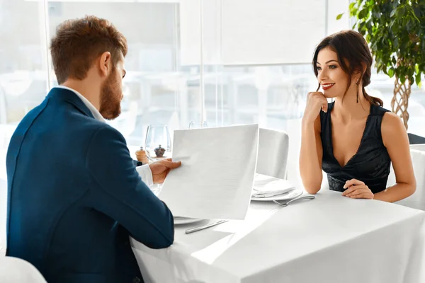 Romantic Couple In Love. Dinner In Restaurant. Romance And Relat