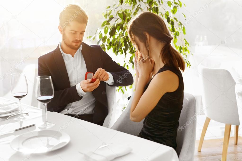 Love. Romantic Couple. Marriage Proposal In Restaurant. Wedding,