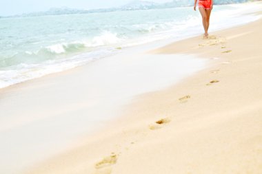 Woman Walking On Beach, Footprints In Sand. Healthy Lifestyle. F