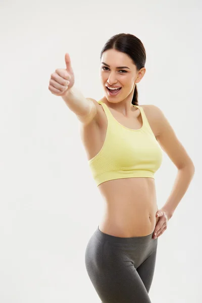 Mujer mostrando pulgar hacia arriba. — Foto de Stock