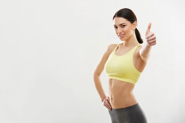 Mujer mostrando pulgar hacia arriba. — Foto de Stock