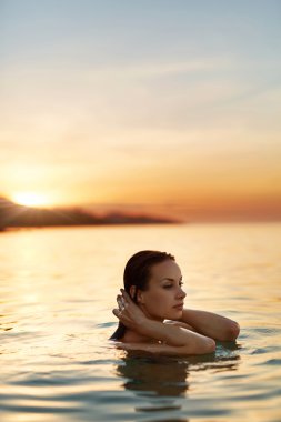 Body Care. Woman Enjoying Sea, Sunset. Healthy Lifestyle. Summer