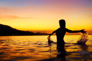 Freedom, Enjoyment. Woman In Sea At Sunset. Happiness, Healthy L