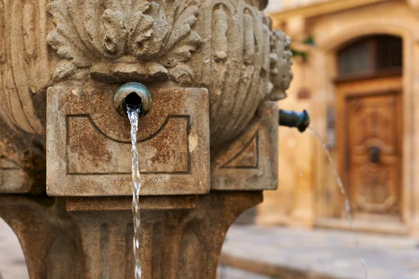 Ancient fountain in Provence Stock Image