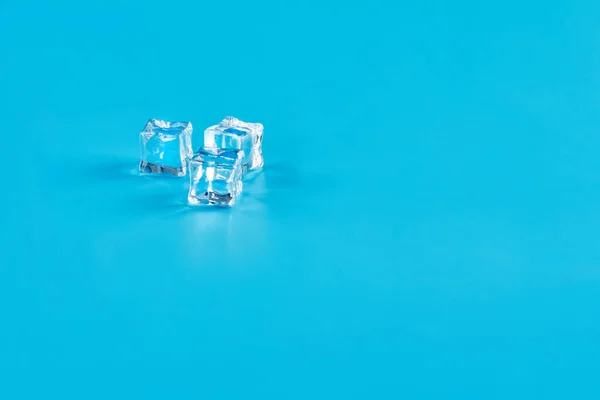 Three Ice Cubes Blue Background — Stock Photo, Image