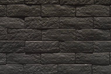 Siyah tuğla duvar yakın plan, arka plan siyah tuğla. Özgeçmiş soyutlaması. Tuğladan yapılmamış duvar yakın plan. Kare taş debriyaj. soyutlama