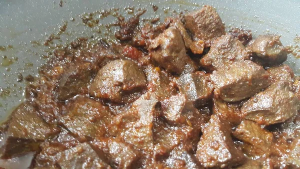 A close up view of Stewed chicken liver withspices  on it, a traditional home made delicious liver dish