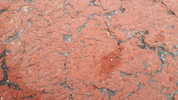 Red Colored Damaged Road Paved Pathway Crackes Different Shpaes Cracked — Stock Photo, Image