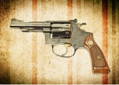 grunge arka plan üzerinde silah