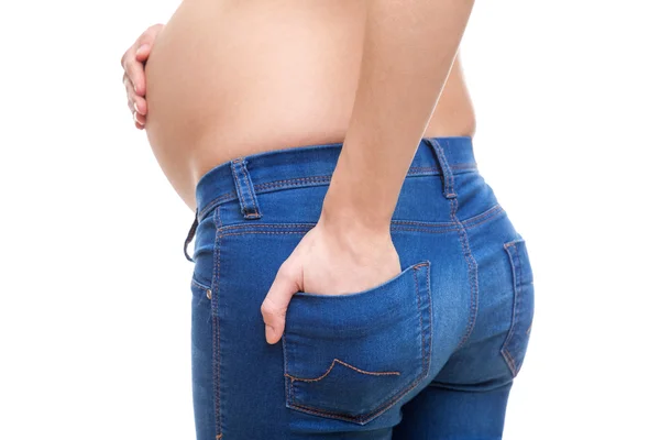 Pregnant woman wearing sexy jeans Stock Picture