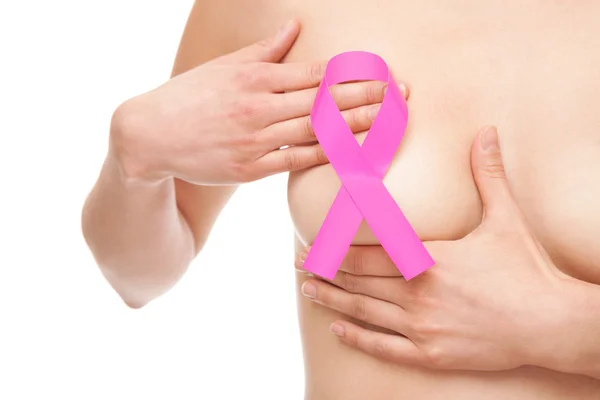 乳がん啓発リボンを持つ女性 ストックフォト
