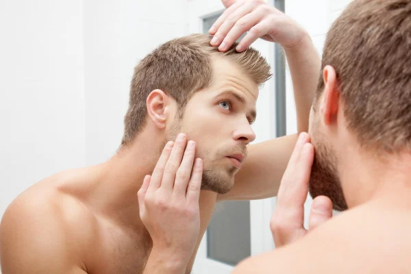 Worrying about hair loss — Stock Photo, Image