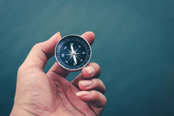 Travel of tourists with compass.